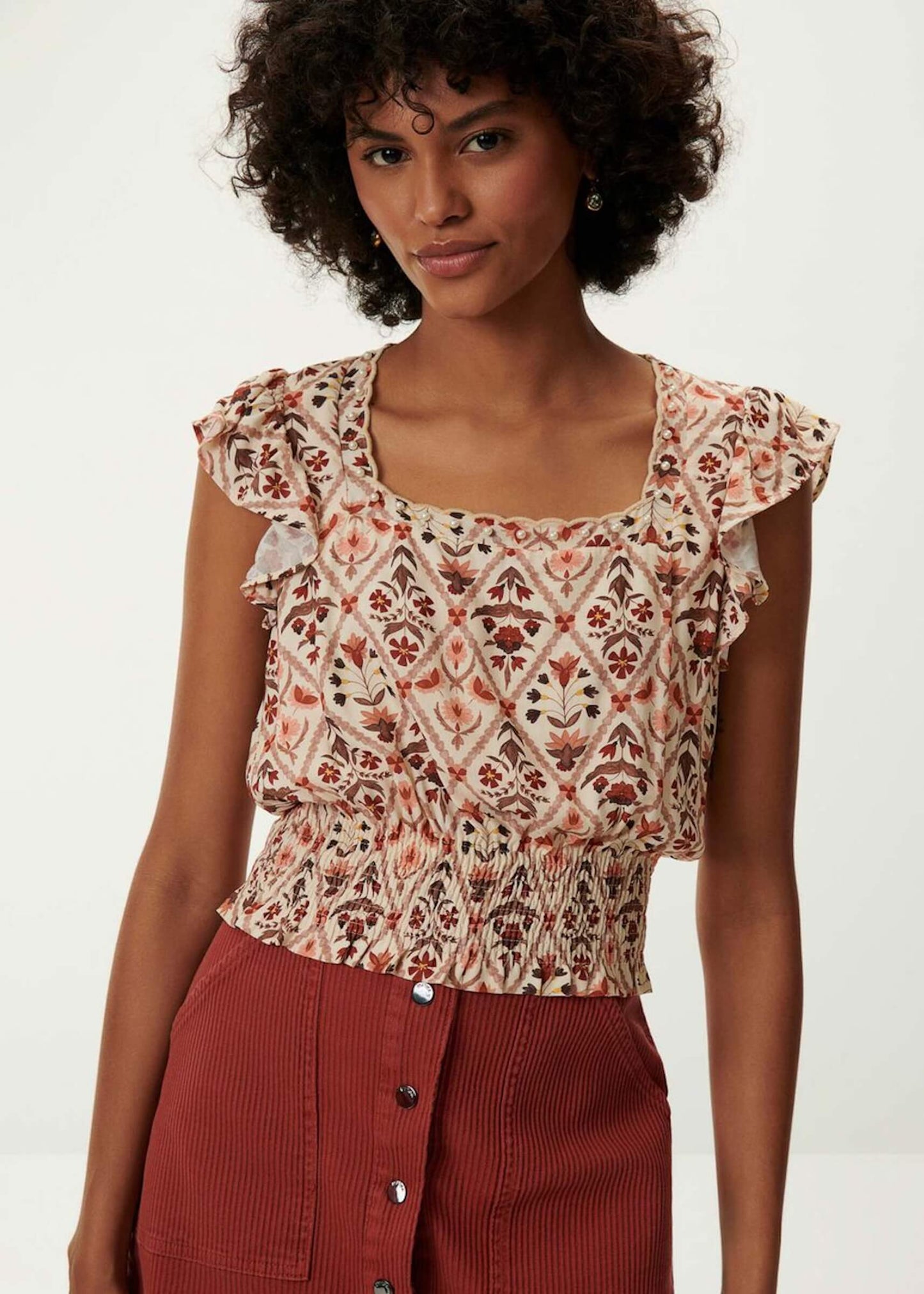 BLUSA ESTAMPADA COM PÉROLAS